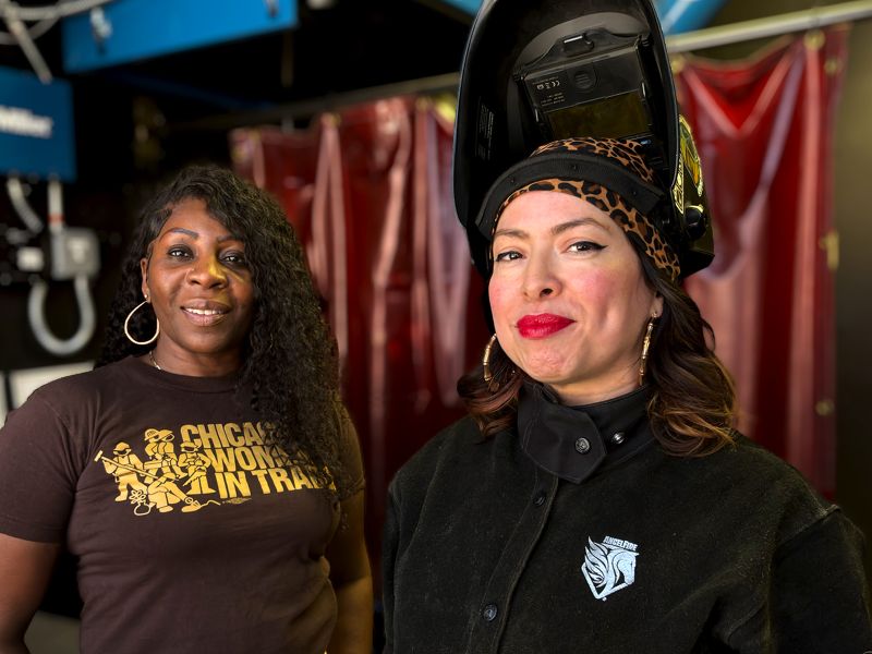 Two tradeswomen on a job site.